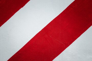 A red and white striped surface with a red stripe on the left and a white stripe on the right