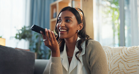 Woman, speaker and smartphone in home for discussion, smile and voice note in living room....