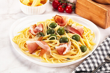 Pasta spaghetti with olives and jamon
