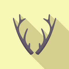 Fototapeta premium Deer antlers casting a long shadow on a yellow background, minimalist concept image for hunting or wildlife
