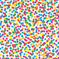 Seamless pattern featuring colorful confetti sprinkles scattered background