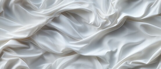 Obraz premium White silk fabric with soft flowing folds.