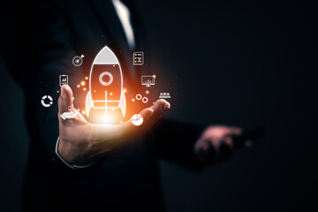 Businessman shows a rocket and icon. Concept of Startup Business, Entrepreneurship Idea, and Online Digital Business. network connection on the interface Online Marketing, Technology and Success.