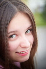 Portrait of young pretty woman with long brown hair