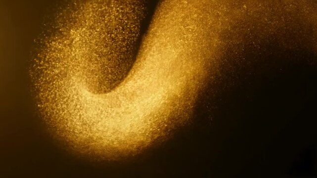 Abstract video of swirling golden dust particles, symbolizing magic, energy, or a cosmic phenomenon, film overlay effect, motion elements, video effects