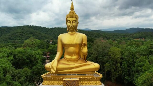 Big Gold Buddha statue at Wat Pha Thang, Uthai Thani, Thailand