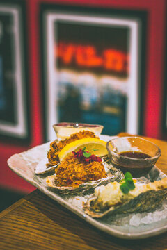 fried oysters including KAKI FRY made from oyster panko, egg mayo & lemon, OYSTER FRITTO with battered oyster & yuzu kosho mayo, CREAM KOROKKE with bechamel, chuno sauce & shibazuke.
