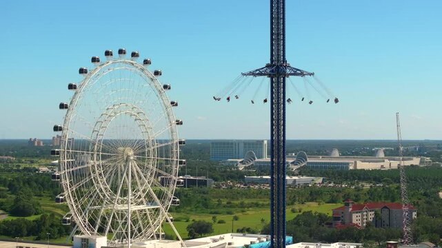 Orlando Starflyer is worlds tallest swing ride near Ferris wheel at Icon Park in Florida. USA tourist attraction