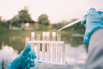 In our biology research, we used a tube to collect water samples for chemical analysis and testing, crucial for understanding aquatic ecosystems. - Powered by Adobe