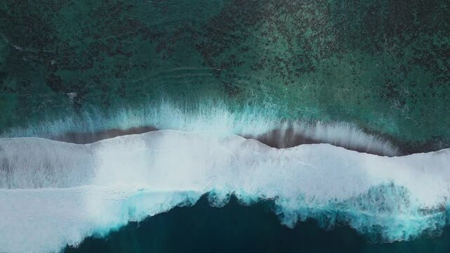Abstract surf waves colorful sun aqua turquoise shallow coral reef Teahupoo Tahiti aerial drone birdseye view French Polynesia surf wave Pacific Ocean Channel Point Faremahora Pass Havae static