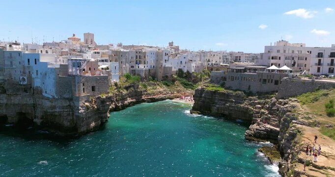 Scenic Lama Monachile Beach In Polignano a Mare, Italy - Aerial Drone Shot