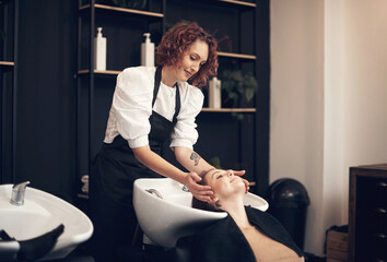 Hairdresser, massage and wash for client hair, salon and treatment with mask and conditioner with...