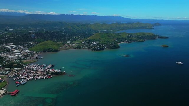 Walter Bay fish market Port Moresby Papua New Guinea  aerial drone capital city Harbour Marina PNG beautiful sunny blue sky morning islands Ela Beach Crown Hotel Plaza Hilton Coral Sea backward