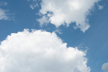 Obraz premium Clouds in the sky. Cloudy sky. Blue sky with big clouds. Blue and white background.