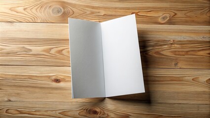 Fototapeta premium DL bi-fold brochure mockup on a wooden surface , brochure, mockup, DL, bifold, design, template, marketing