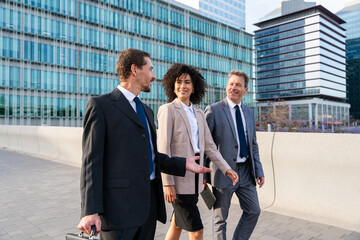 Multiracial group of business people bonding outdoors - International business corporate team...