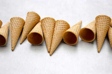 Waffle cones on grey background