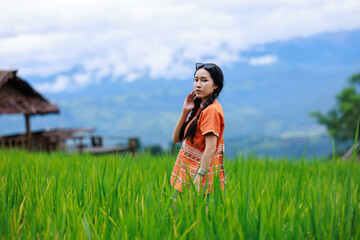 asian woman traveling tourist  at green rice terrace of Ban pa bong piang at morning fog in...