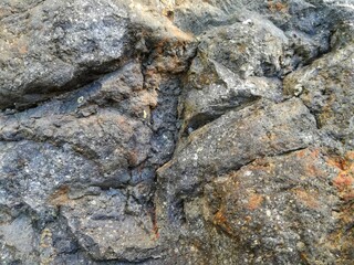 Gray stone with rough texture to background, backdrop or wallpaper texture 