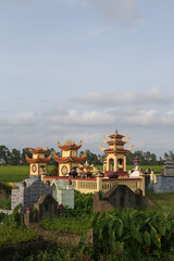 Cemetery near Hanoi city, Vietnam. Traditional national Vietnamese old cemetery. Graves, gravestones and beautiful landscape, scenery. Memorial, buddhist landmark, monument. Asian tradition. Holiday