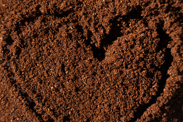 Painted heart on ground coffee, I love coffee.