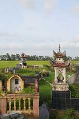 Cemetery near Hanoi city, Vietnam. Traditional national Vietnamese old cemetery. Graves, gravestones and beautiful landscape, scenery. Memorial, buddhist landmark, monument. Asian tradition. Holiday