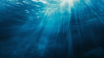 Fototapeta premium Abstract image of Tropical underwater dark blue deep ocean wide nature background with rays of sunlight and blue sky in background : Generative AI