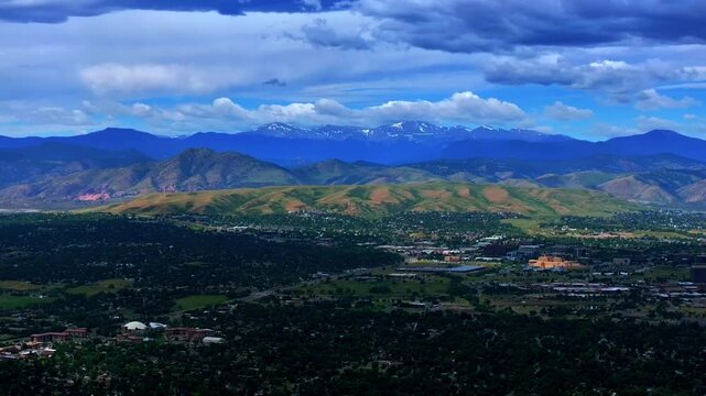 Summer Denver Colorado aerial drone Golden Arvada Lakewood cloudy front range foothills landscape Mount Blue Sky Red Rocks Amphitheater neighborhood homes blue skies clouds forward pan reveal motion