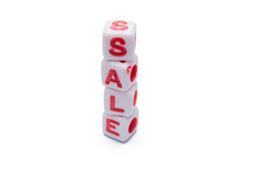 Stacked dice spell out the word sale