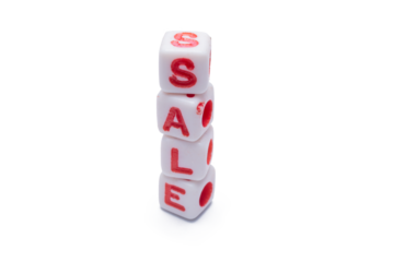 Stacked dice spell out the word sale