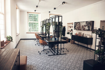 Hair salon, interior and design for small business with furniture, mirror and cleaning service for luxury wellness. Store, reflection and startup with tools, equipment and treatment for barber care