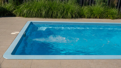 In the home pool, the counter-current system is turned on, making it an excellent place to swim in the backyard