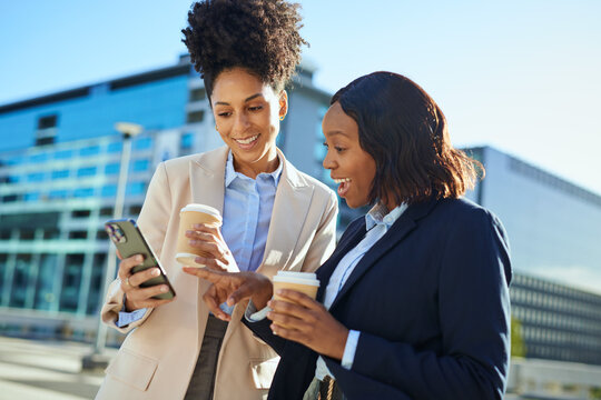 Diverse Business Women Enjoying Coffee Break in Urban Setting - Powered by Adobe