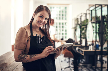 Hair care, portrait and woman with tablet in salon for work, appointment or online information....