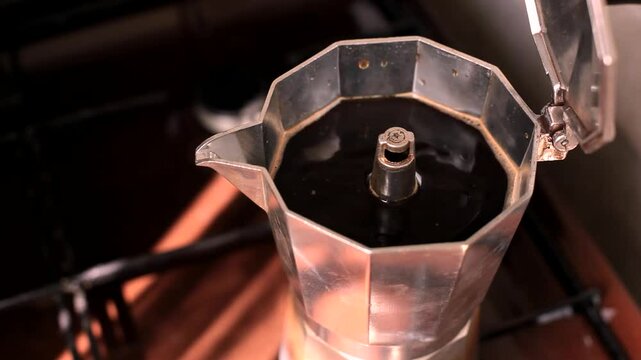 Close-up hot black coffee in a vintage coffee maker. 
