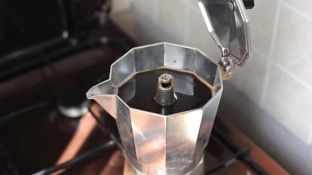 Close-up of a geyser coffee maker with bubbling coffee.