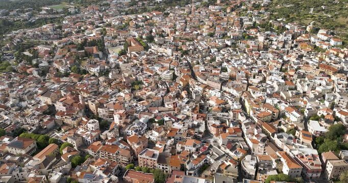 Historic Village Of Dorgali In Sardinia, Italy And Supramonte Mountains. Aerial Shot. 