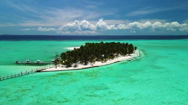 Onok Island sandbar and palm grove in turquoise sea