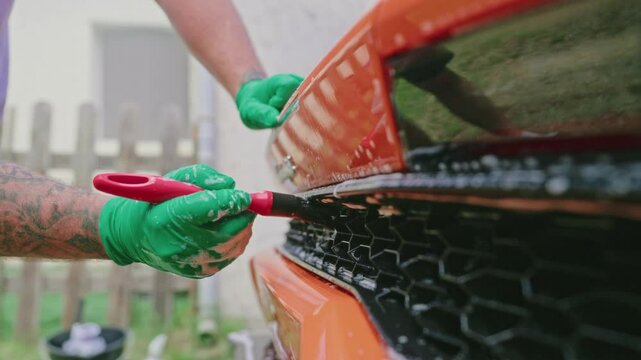 Cleaning Car Grille Close-Up 4k