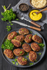 frikadeller, danish meatballs on a plate, top view