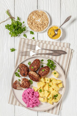 frikadeller, danish meatballs on a plate, top view