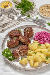 frikadeller, danish meatballs on a plate, top view