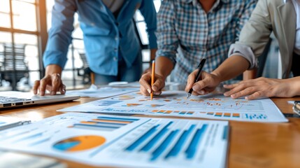 Group of colleagues reviewing and analyzing data on student achievements Stock Photo with copy space