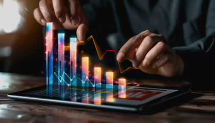 Professional analyzing dynamic charts on futuristic holographic tablet