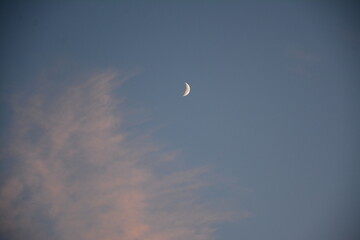 Crescent moon, blue sky and clouds
