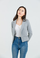 Asian female attractive smiling happy cheerful successful employee businesswoman, she wearing casual classic blazer and standing on white background isolated studio portrait. Lifestyle concept.