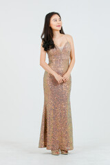 Full body portrait of asian beautiful woman wearing elegant sparkling evening dress, Attractive female model smiling happy fashion, standing posing on white background isolated studio.