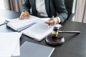 Lawyer businessman working with lawbook in office or courtroom Legal counsel with gavel and legal law. justice and lawyer concept Judge gavel hammer on Lawyer desk