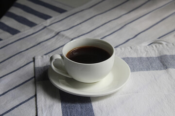 A cup of hot black coffee. Close-up