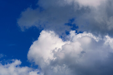 sky is overhead. white cumulus and rain dark clouds, contrast, sky on the screensaver, background